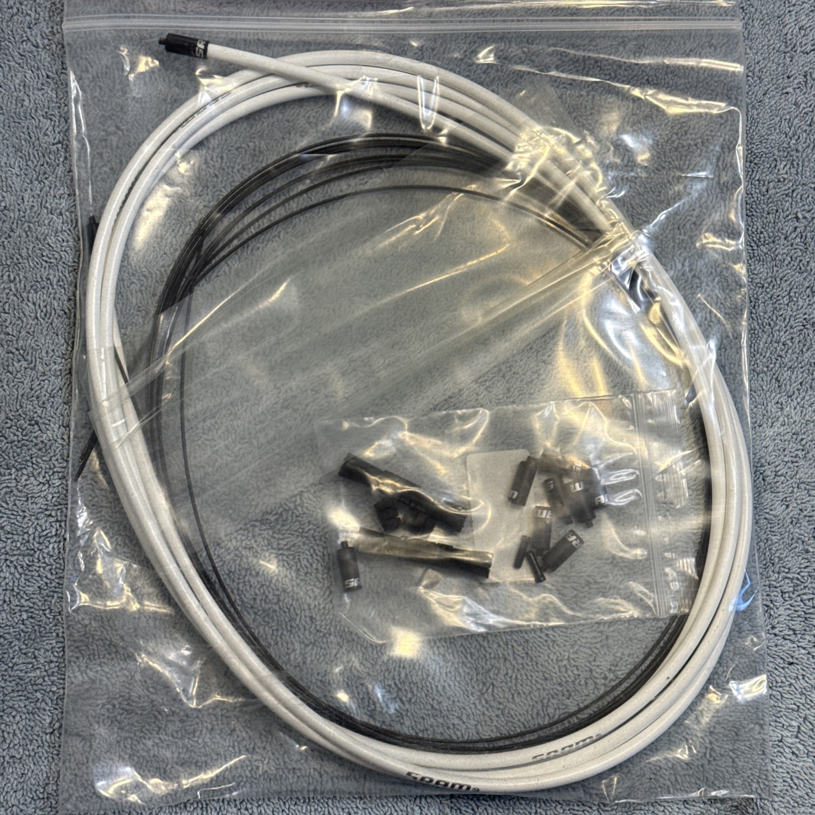 SRAM SlickWire Shift Cable and Housing Kit – Road/MTB, 4mm, White [ssg]