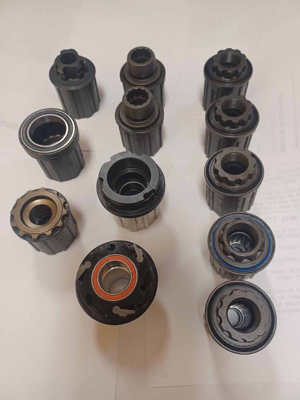 GROUP OF 12 ASSORTED BICYCLE FREEHUB BODIES NEW AND USED SEE DESCRIPTION