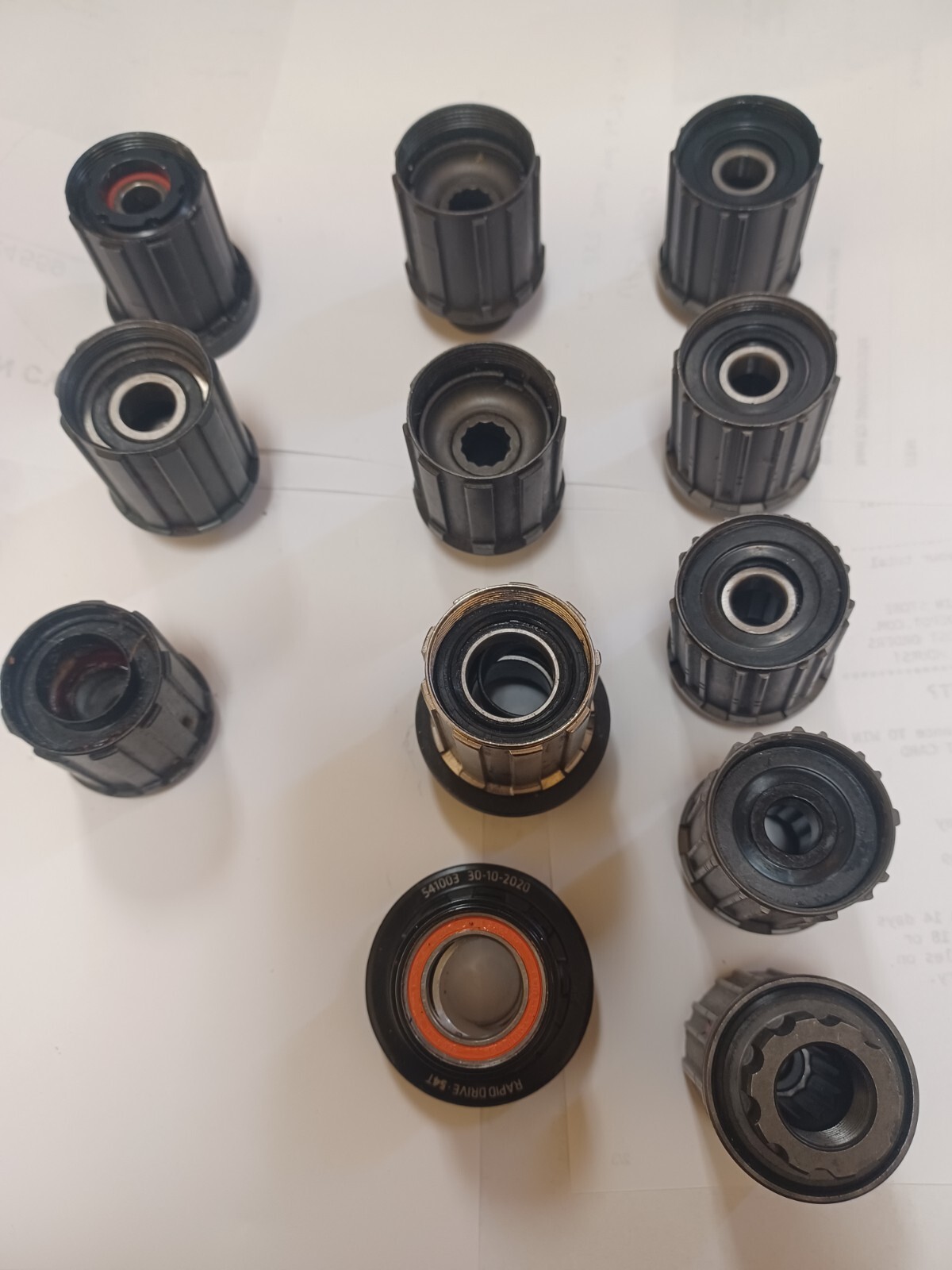 GROUP OF 12 ASSORTED BICYCLE FREEHUB BODIES NEW AND USED SEE DESCRIPTION