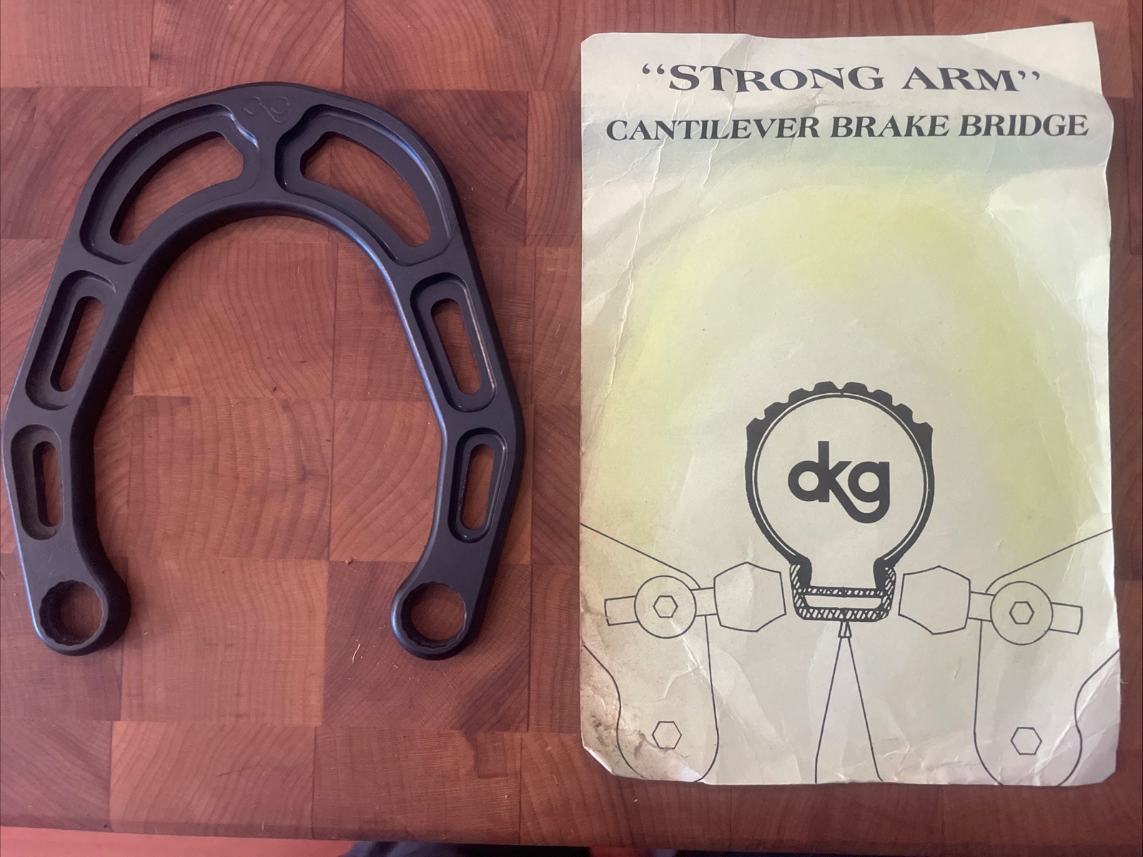Vintage New-Old-Stock DKG “Strong Arm” Cantilever Brake Bridge • Black. (FSW)
