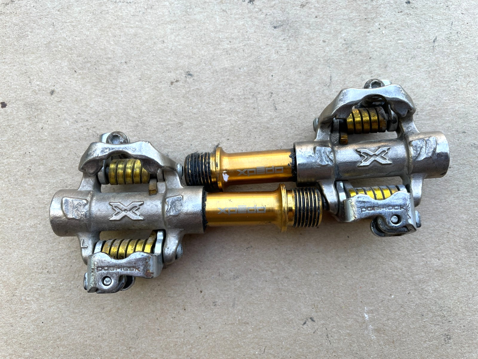 Xpedo “posi-lock” clipless pedals Silver/Gold
